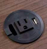 Power Center Fits 2.25" Grommet hole. Features 1 power outlet and 1 USB connection with optional data or charge. 5' power cord, 40" USB cable. Stocked in Black.